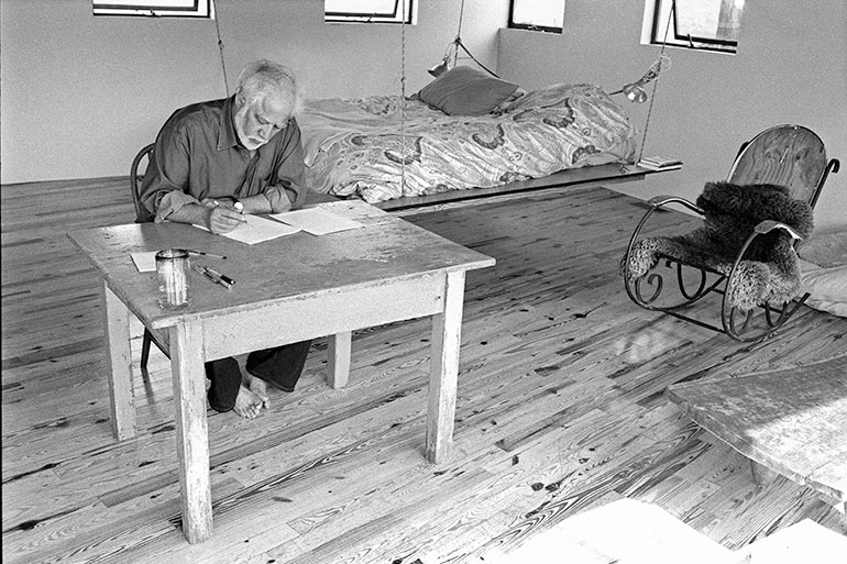 Portrait of Michael Ondaatje in a cabin