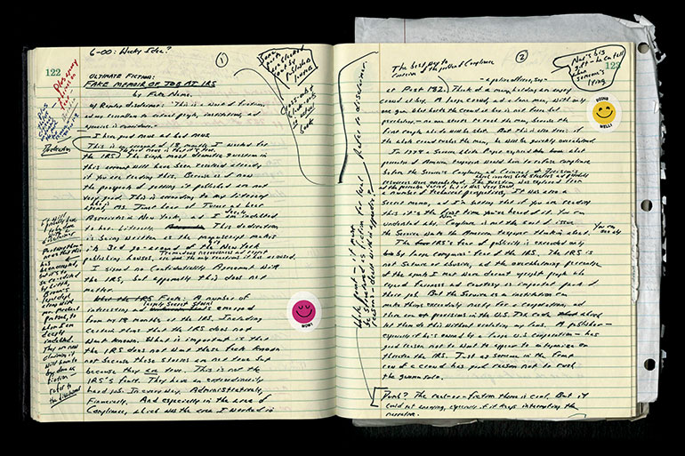 Notebook with handwriting and clippings