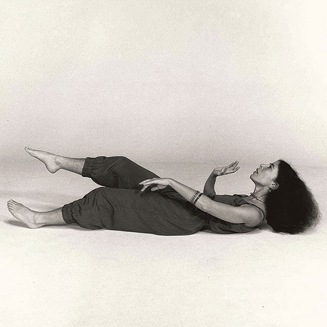 Deborah Hay performing while reclined on floor